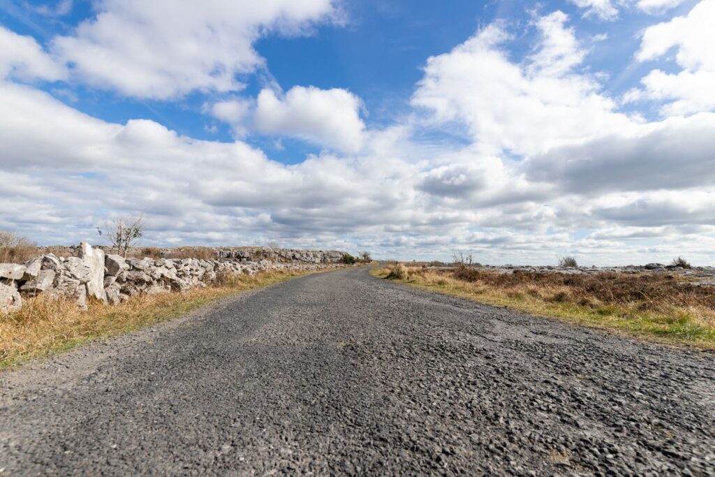 Rural road bordered by stone walls