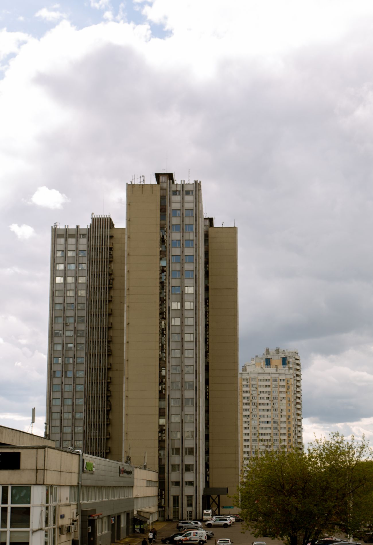 High-rise buildings under a cloudy sky