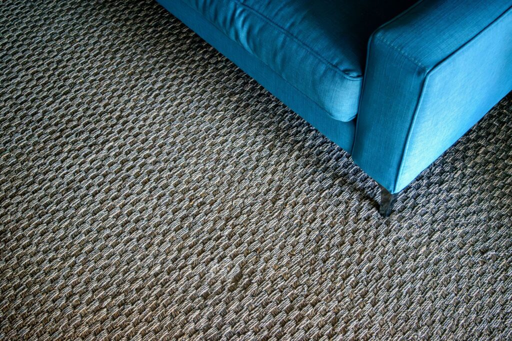 Blue armchair on textured carpet