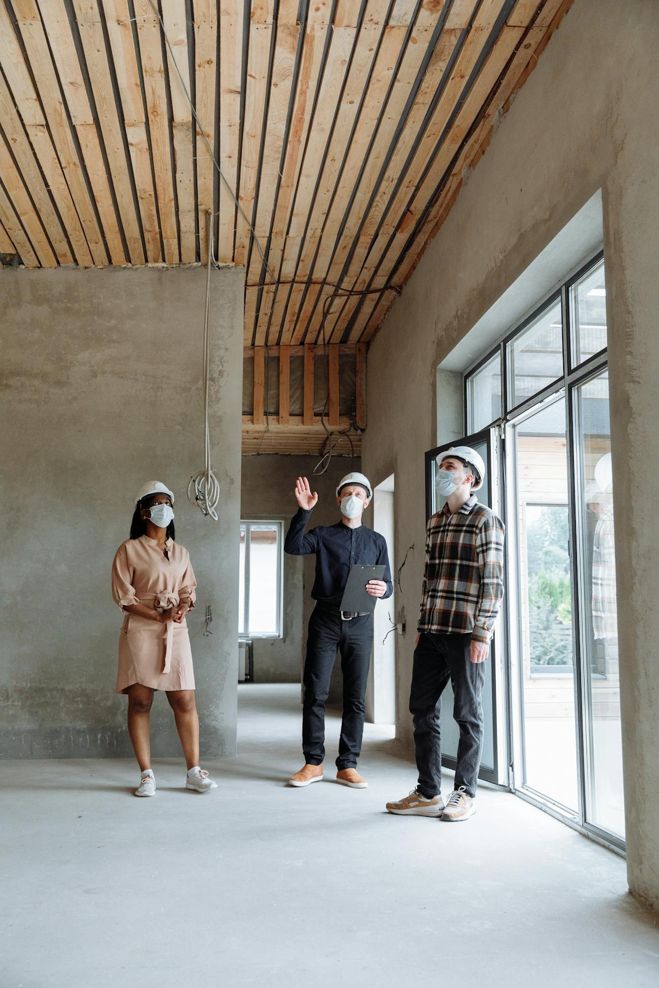 Inspectors reviewing unfinished interior space