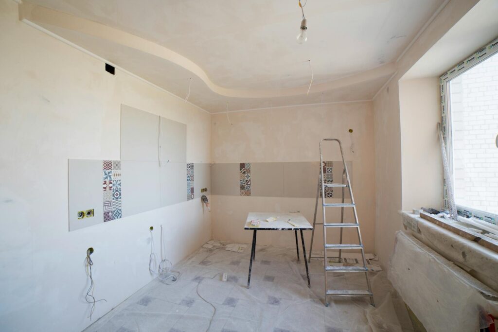 Room under renovation with ladder and wiring