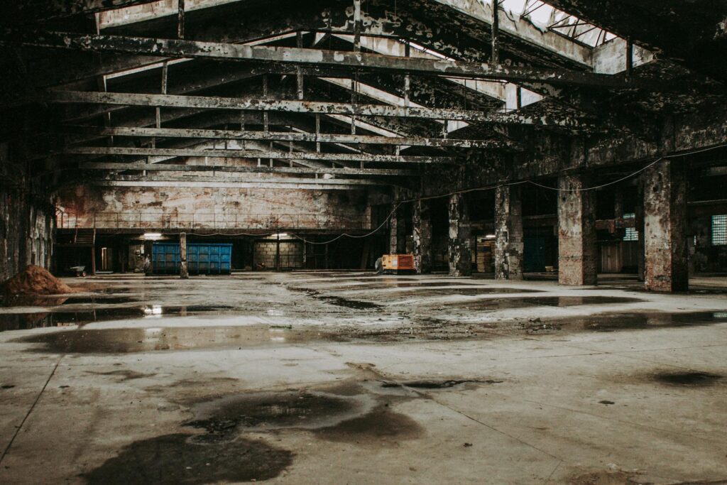 Large industrial space with fire-damaged interior