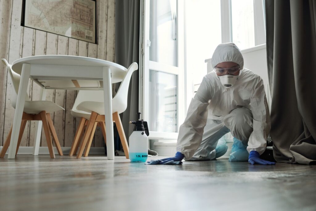 Technician collecting a lead dust sample from a hardwood floor