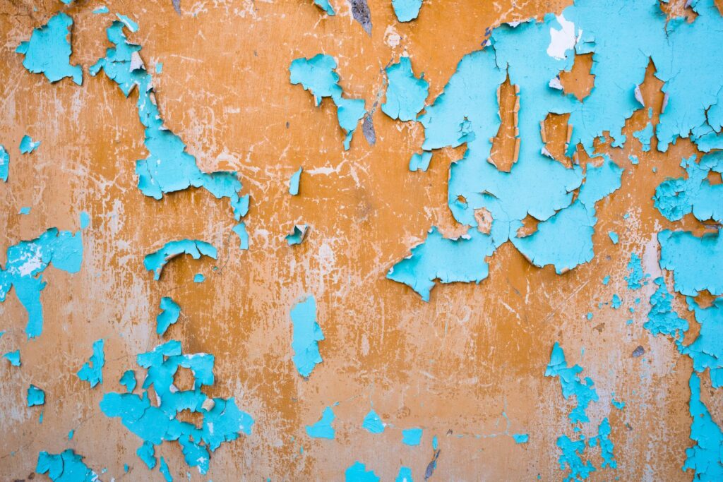 Close-up of peeling paint on an older wall