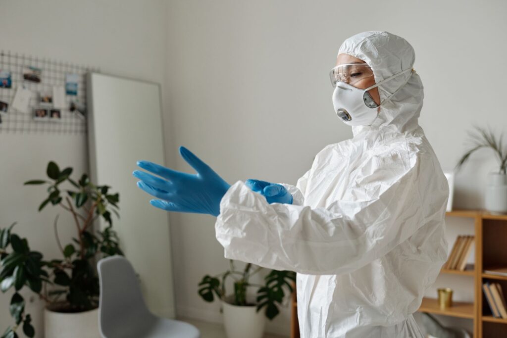 Technician wearing protective gear before mold inspection or testing