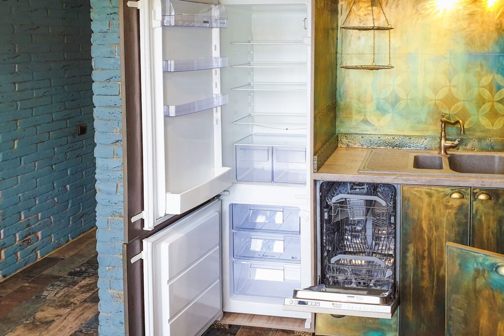 Open refrigerator and dishwasher in a modern kitchen